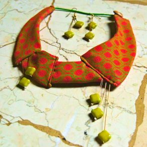Orange Shwe-Shwe fabric with green clay beads necklace and matching earrings